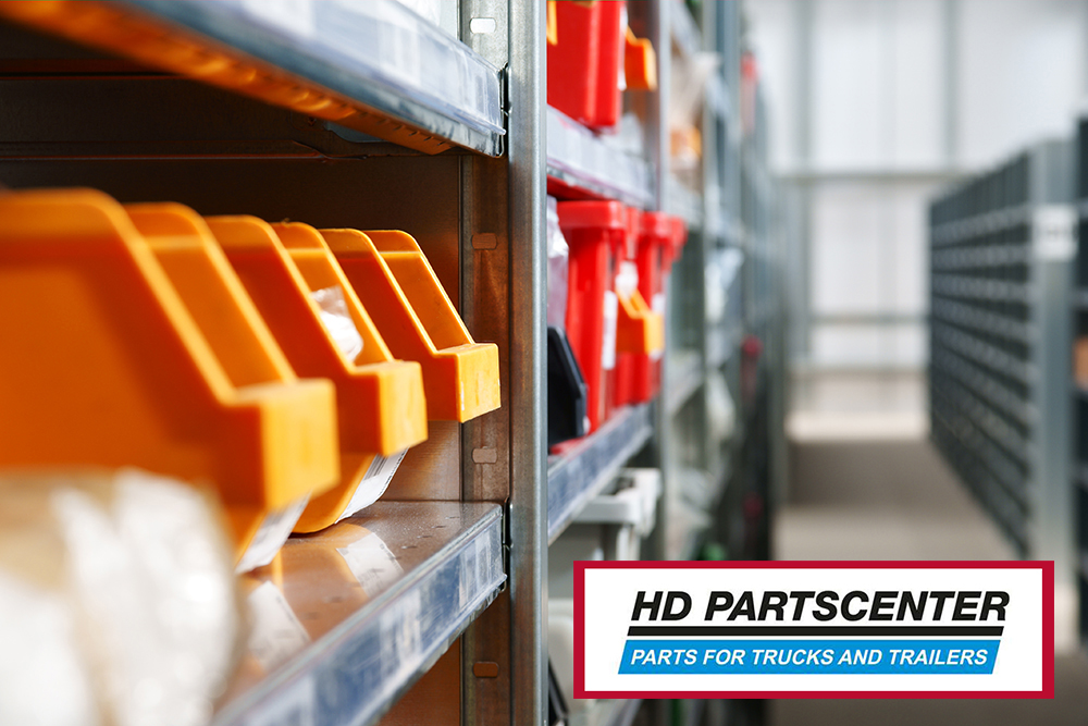 Storage bins and racks for storing parts and components in a warehouse shot with shallow focus