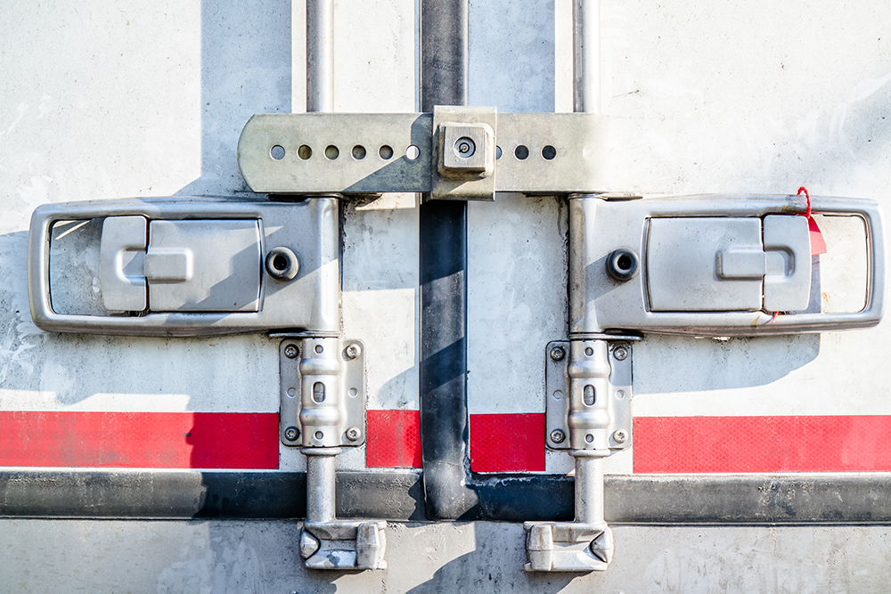 trucks parking at sunset sky, freight industry delivery shipment transport.